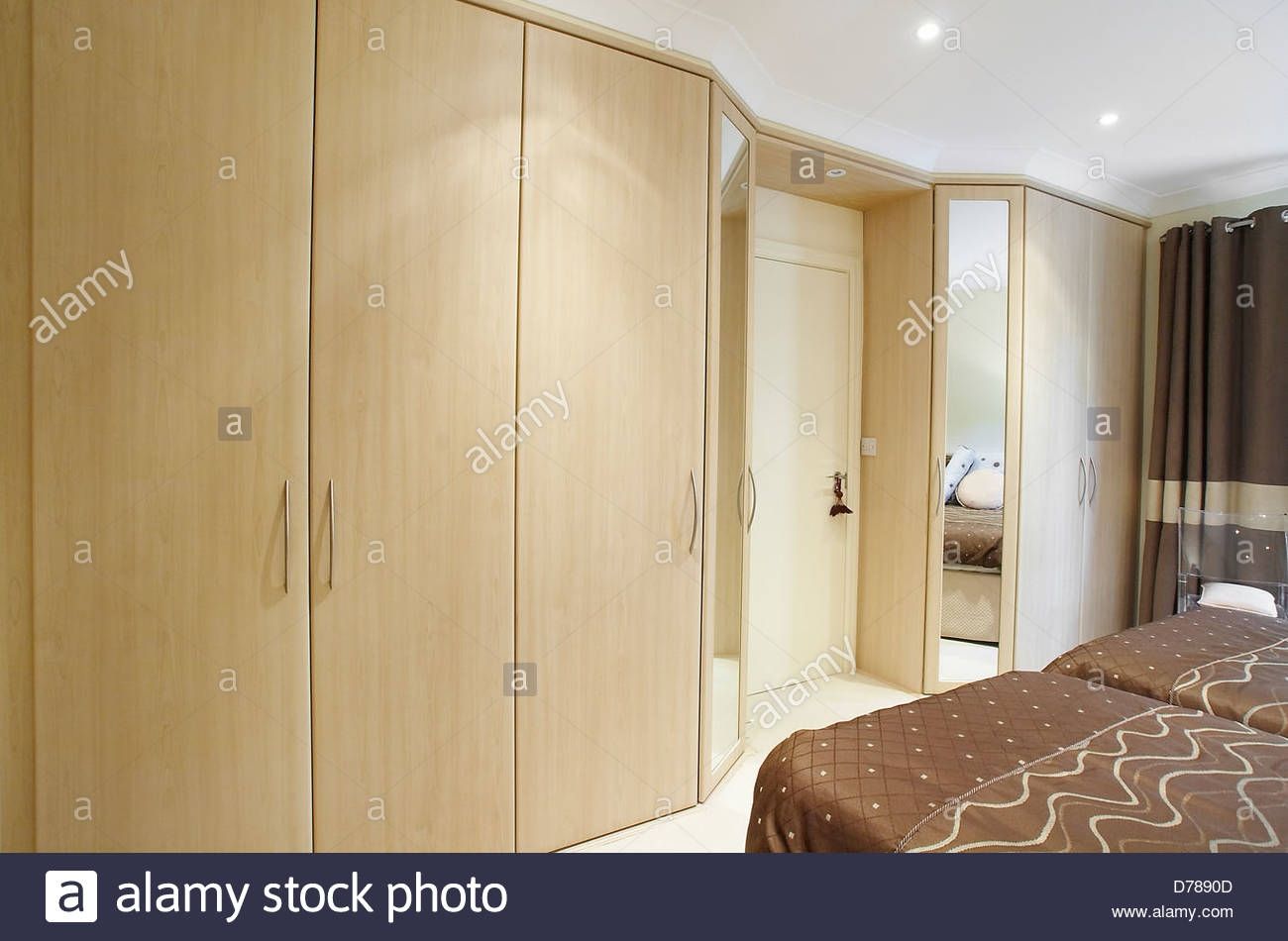 A Bedroom With Fitted Wooden Wardrobes In A House In The Uk Stock Pertaining To Fitted Wooden Wardrobes (Photo 1 of 15)