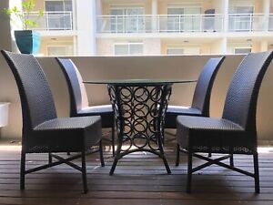 Genao 35'' Dining Tables In Best And Newest Elegant Equator Outdoor Dining Table With 4 Wicker Chairs (View 17 of 20)