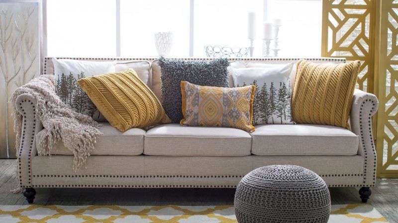 5 Ways To Decorate A Neutral Sofa With Throw Pillows With Regard To Yellow And Black Console Tables (Photo 16 of 20)