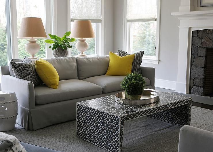 Gray Sofa With Bright Yellow Pillows And Black Waterfall Intended For Yellow And Black Console Tables (View 10 of 20)