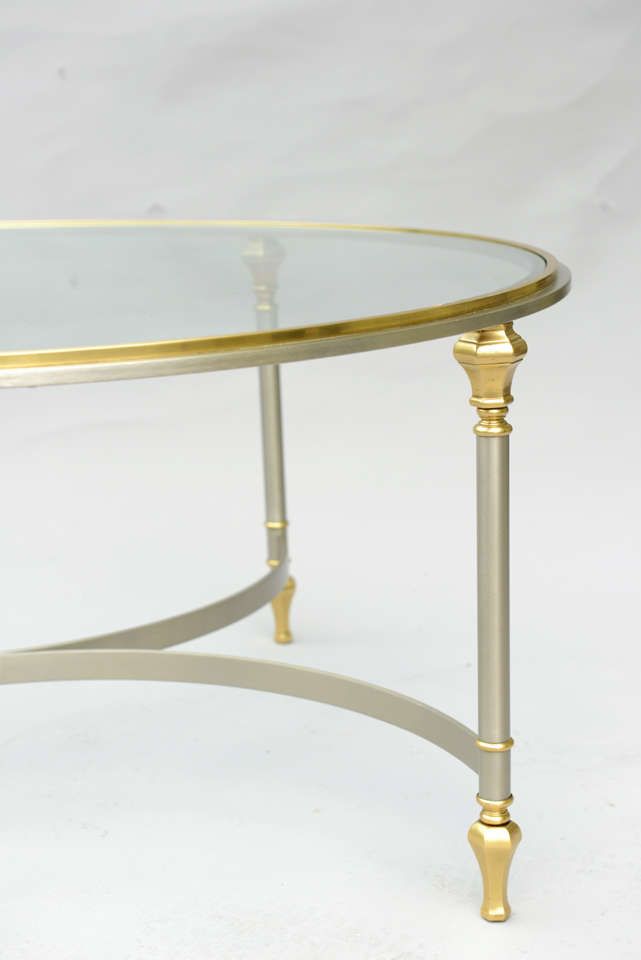 Round Cocktail Table Of Polished Steel With Brass Accents Throughout Polished Chrome Round Console Tables (View 15 of 20)