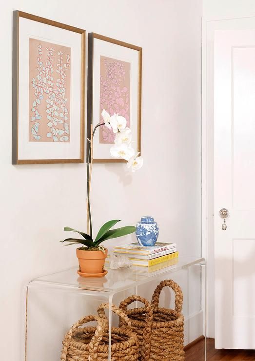 Seagrass Baskets Tucked Under Clear Acrylic Console Table Regarding Natural Seagrass Console Tables (Photo 5 of 20)