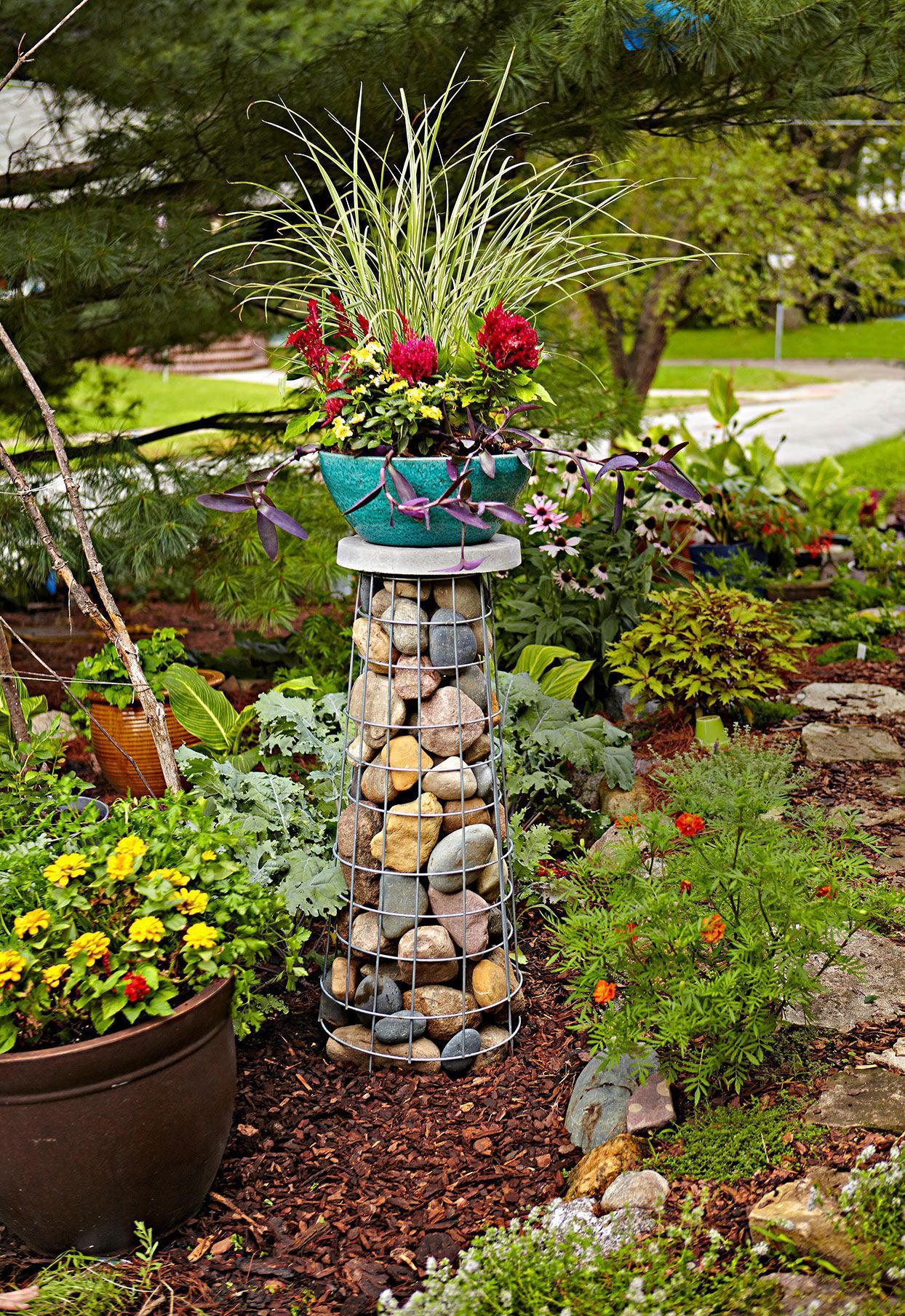 How To Build A Gabion Plant Stand That Will Add A Statement Vertical Accent  To Your Garden | Garden Plant Stand, Garden Art, Container Gardening With Regard To Stone Plant Stands (Photo 3 of 15)