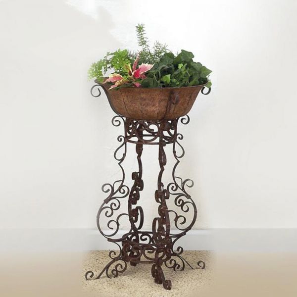 Medium Brown Taupe Iron Four Leg Plant Stand With Planter Inside Brown Plant Stands (View 12 of 15)