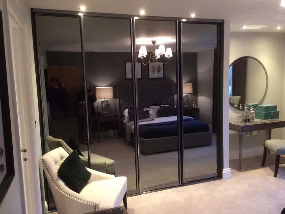 Glass Sliding Wardrobes | Mirrored Fitted Wardrobes | Glide & Slide Inside Black Glass Wardrobes (Photo 9 of 15)