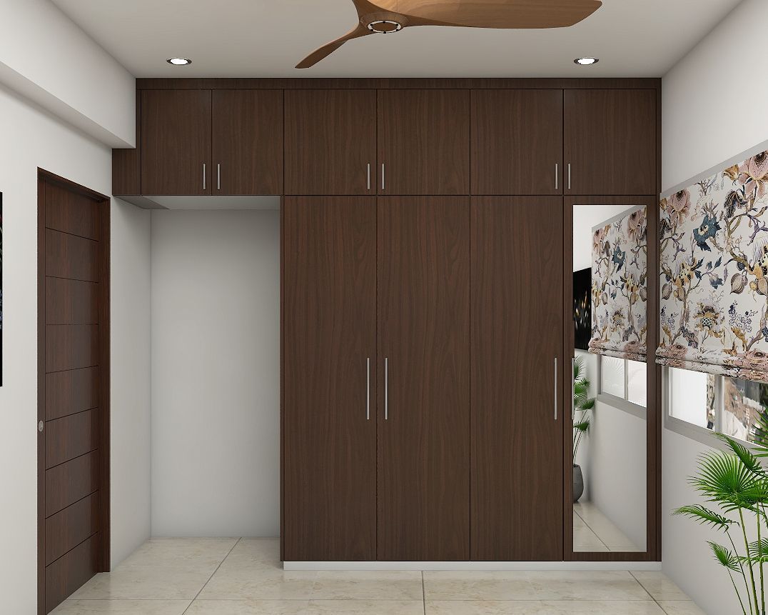 Modern Compact 4 Door Wooden Wardrobe Design With Mirror | Livspace In Wardrobes With 4 Doors (Photo 10 of 15)