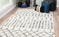 15 Collection of Ivory and Black Rugs